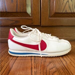 Nike Kids White Sneakers with Red Swoosh and Blue Accent - Size 7Y